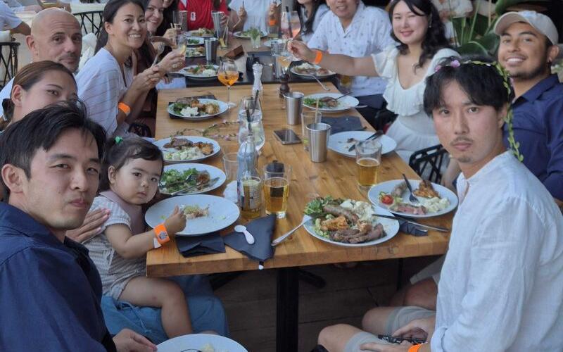 SEO Butler team sharing a meal around a long restaurant table