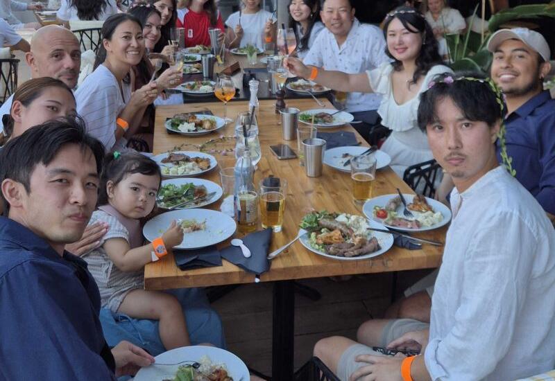 SEO Butler team sharing a meal around a long restaurant table