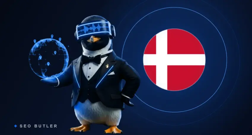 SEO Butler penguin butler holding a glowing globe beside the Danish flag - Denmark link building and SEO