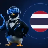 SEO Butler penguin butler holding a glowing globe beside the Thai flag - Thailand link building and SEO
